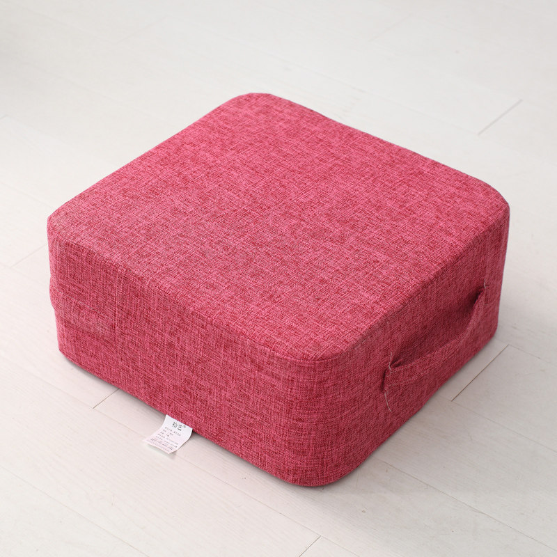 Single burgundy square linen cushion, visible side handle and zipper removable cover
