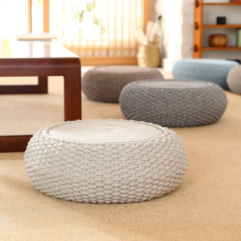 Handknit cotton floor pouf with solid wood frame, for zen tea room and minimalist interiors