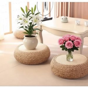 Handwoven rattan floor pouf with solid wood frame, minimalist style for living room