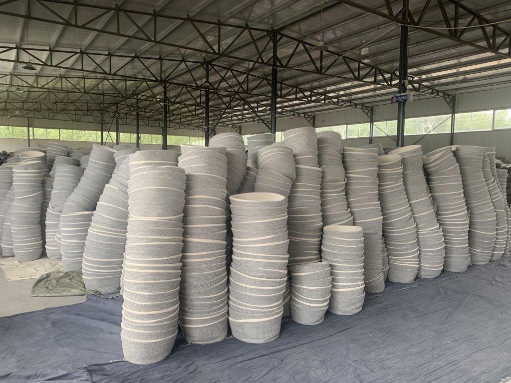 Neat vertical stacks of completed cotton rope baskets held in Woven Natural bulk inventory zone