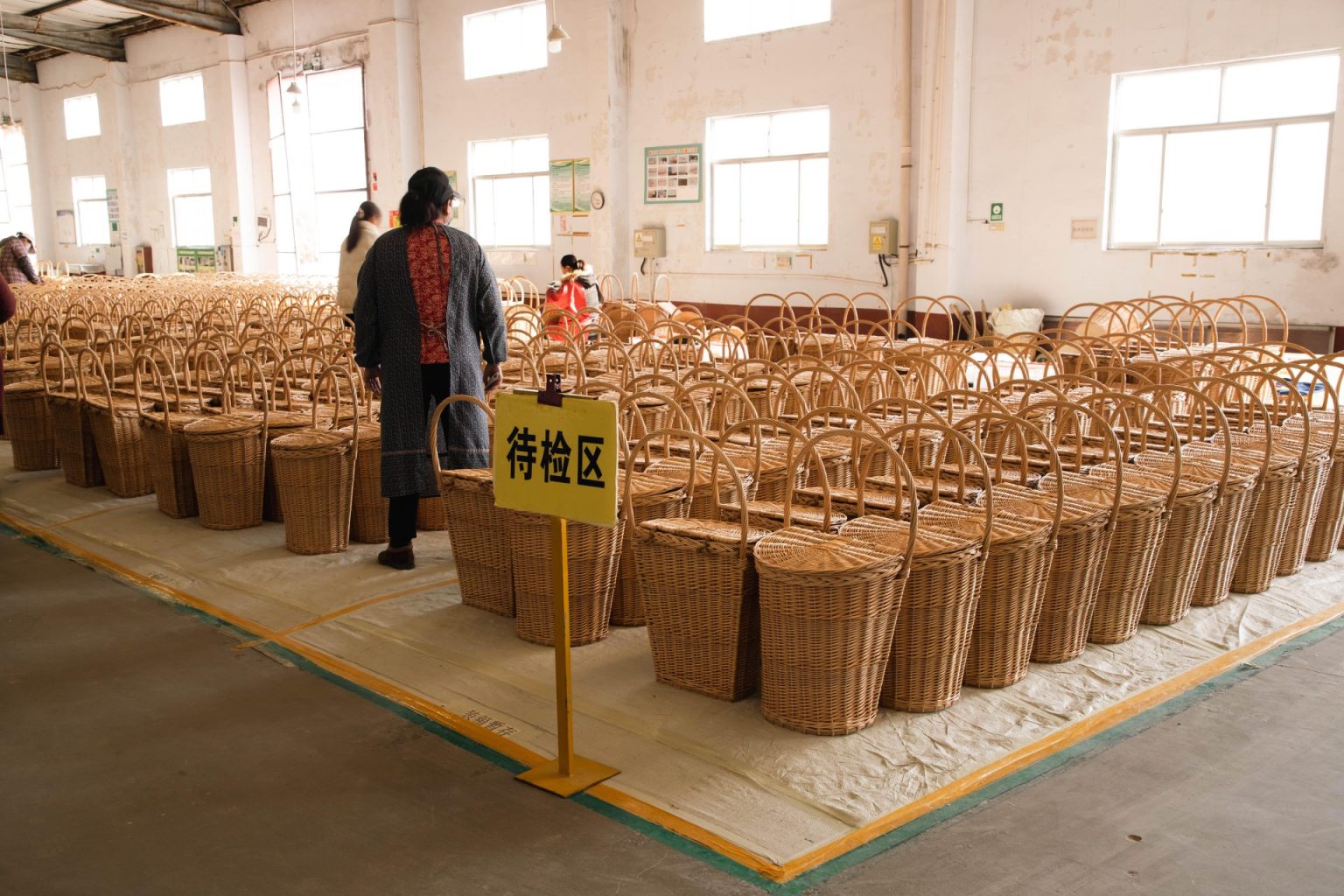 Neatly arranged rattan baskets waiting for quality inspection at Woven Natural’s dedicated pre-check zone for custom wholesale orders